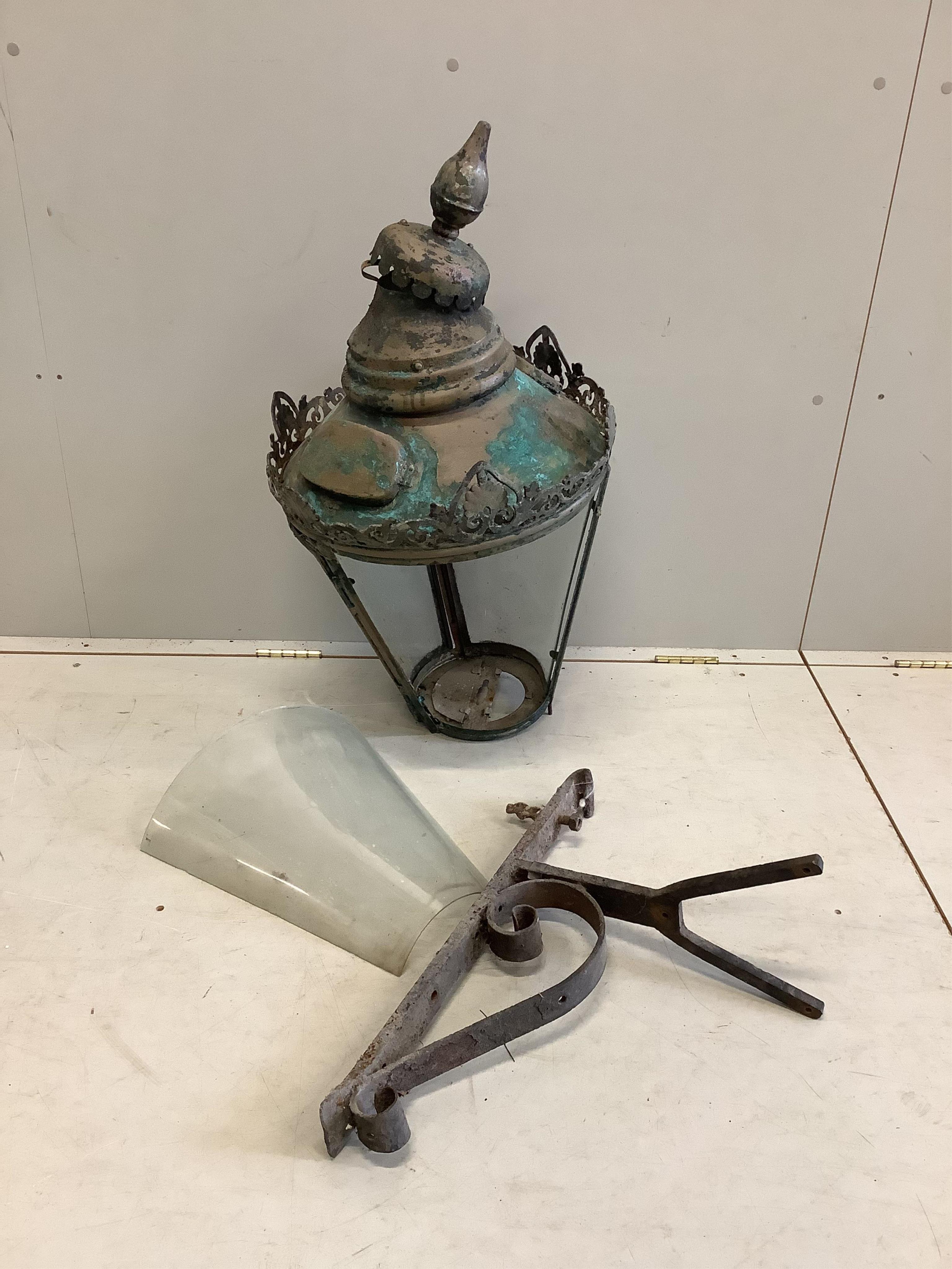 A Victorian copper and lead street lantern with wrought iron wall bracket, height 80cm. Condition - poor.